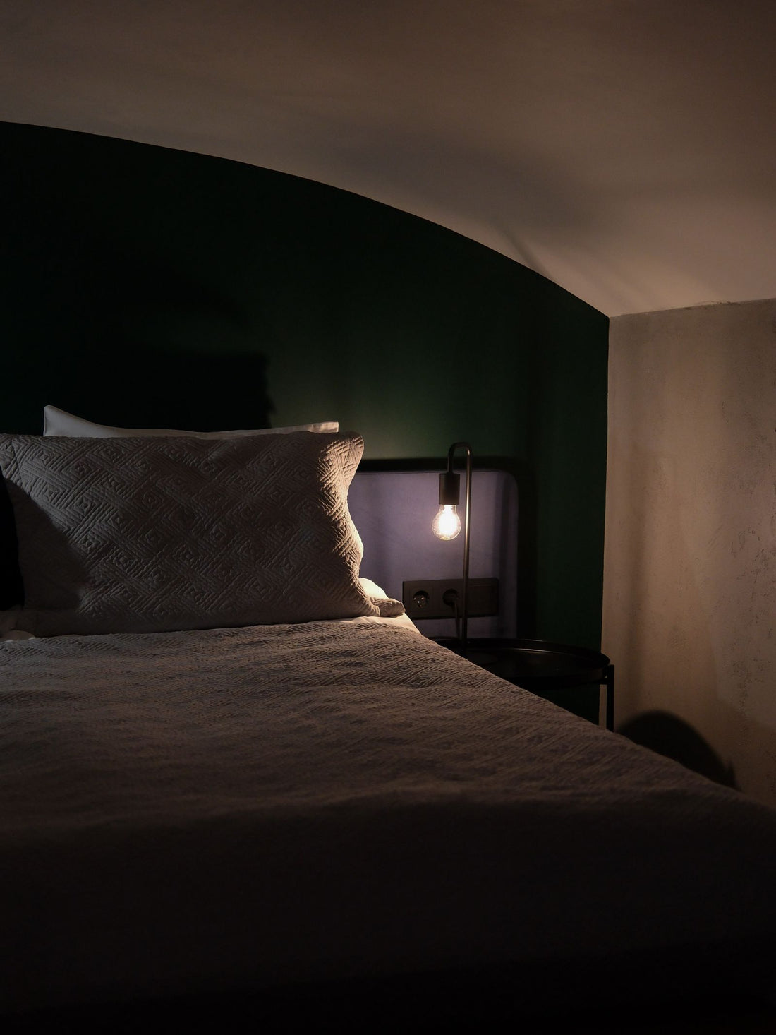 A cozy, welcoming bedroom with soft lighting